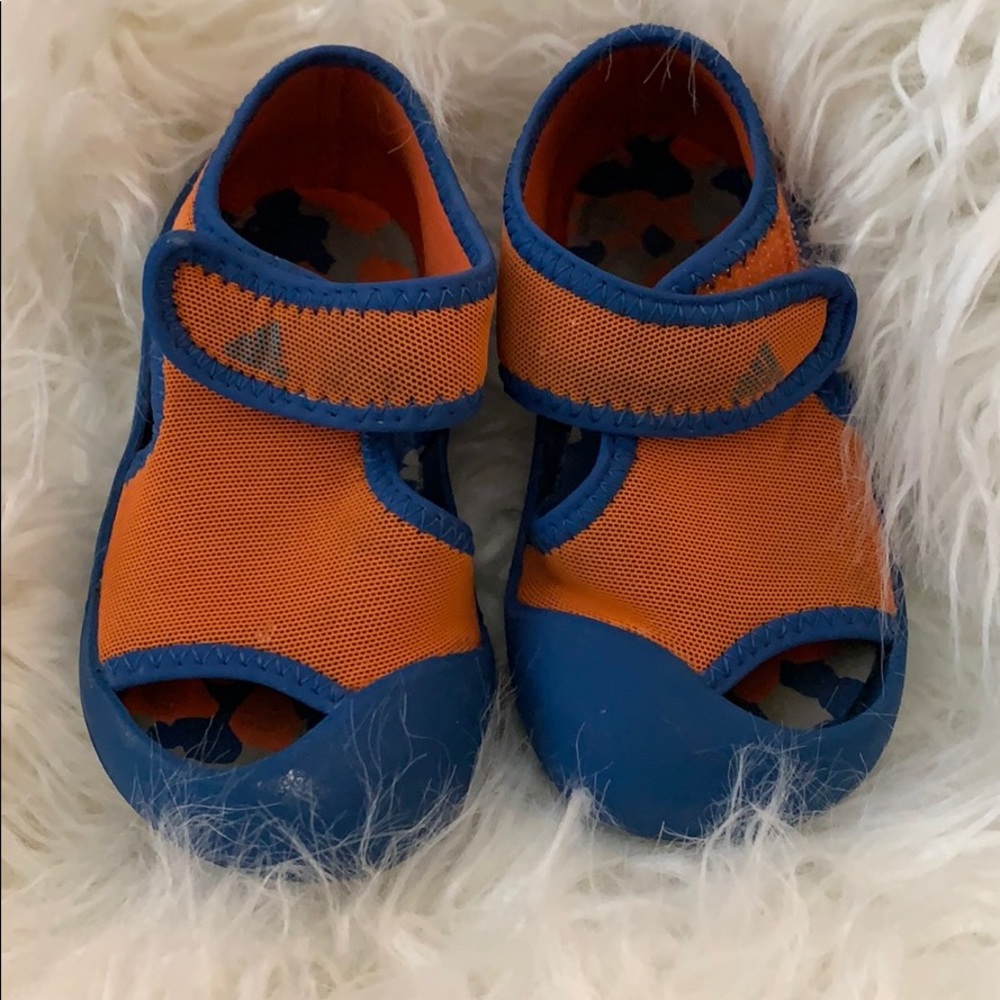 Orange and blue adidas water shoes